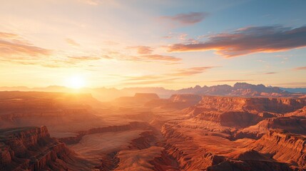 A breathtaking view of a vast canyon at sunset, showcasing stunning rock formations under a warm golden sky. Perfect for nature enthusiasts and travelers.
