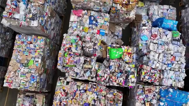 Waste paper bales stored in a recycling facility
