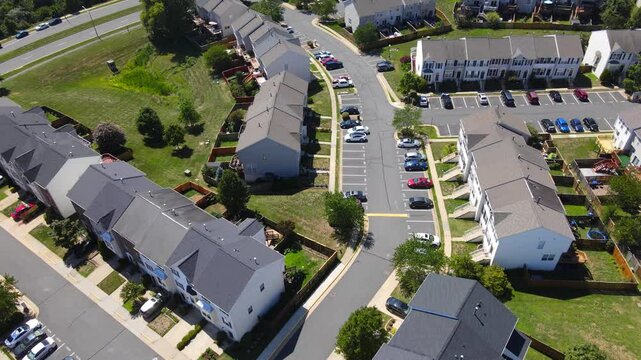 Apartment residential condos in Leesburg. Virginia. suburban area. American condominiums with parking near the house  in Washington suburbs.
