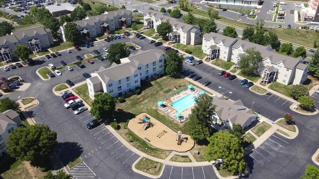 Apartment residential condos in Leesburg. Virginia. suburban area. American condominiums with parking near the house  in Washington suburbs.
