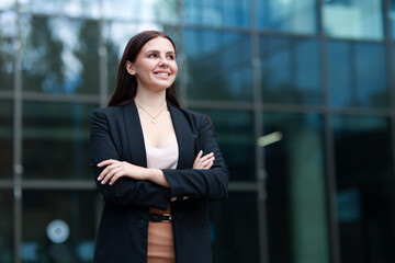 Fototapeta premium Beautiful woman in stylish formal suit outdoors. Space for text