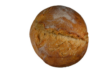 Freshly baked round bread loaf resting on a clean white surface after being taken out of the oven