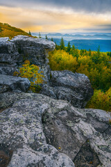 USA, West Virginia, Dolly Sods Wilderness Area. Sunrise on mountain boulders and forest.