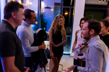 A social gathering in an inviting indoor space emphasized by a warm and friendly interaction among attendees.