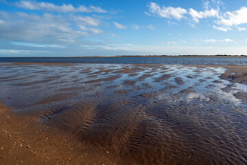 El Portil beach, between the municipalities of Cartaya and Punta Umbría. The sun bathes long, beautiful kilometers of white sand. Andalusia, Spain. vacations concept