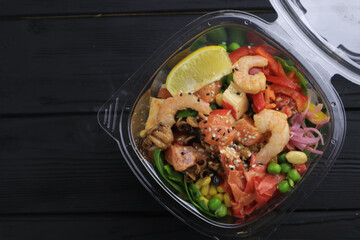 Tasty poke food with seafood and vegetables