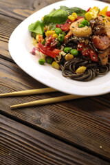 Tasty poke food with seafood and vegetables