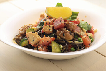 Tasty poke food with seafood and vegetables