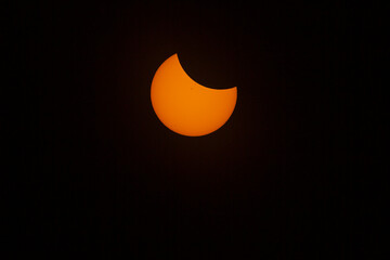 USA, Wyoming. Total solar eclipse. Sun about 1/4 covered.