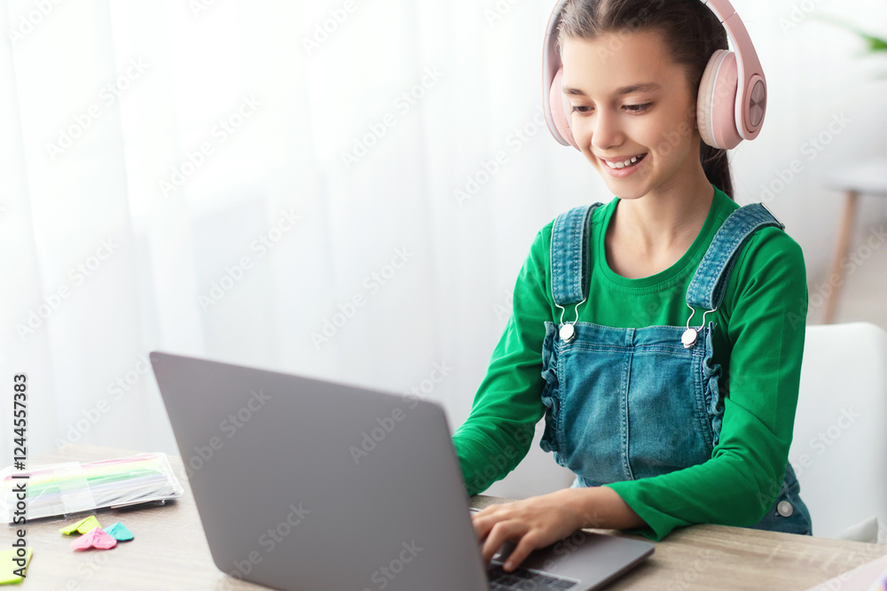 Poster e-learning concept. smiling female teenager studying online on laptop computer at home. happy youth 
