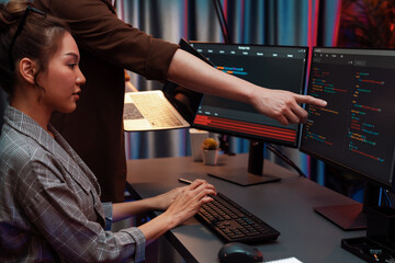 Serious of IT developers discussing intelligent website development coder system running data...