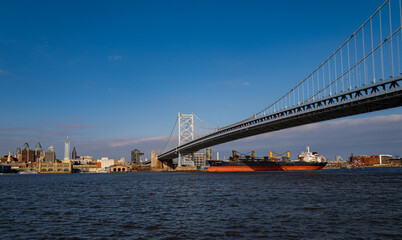 Naklejka premium The architectural beauty that is the Ben Franklin Bridge spanning across the Delaware River between Camden NJ and Philadelphia Pennsylvania