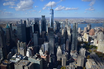 Aerial view of Manhattan’s skyline with skyscrapers, rivers, and streets. Urban landscape, New York City, cityscape, architecture, aerial photography, metropolis, travel, modern city, iconic view
