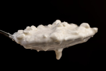 cottage cheese made from lumps with cream close-up