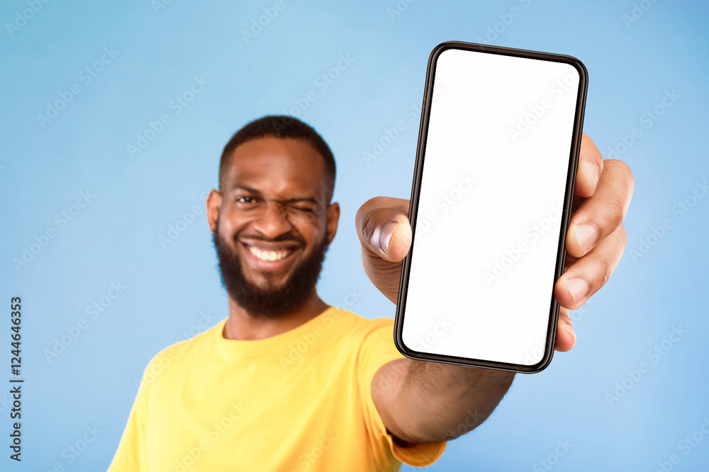 Poster mobile app advertisement. smiling young african american man showing smartphone with empty screen, w