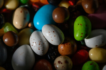 Explore the vibrant world of colorful candy-coated treats in a delightful assortment of shapes and sizes
