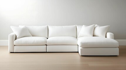 minimalist, living room, interior, design. A sleek, modern white sectional sofa with plush cushions, perfect for contemporary living spaces and cozy relaxation.
