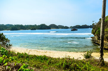 Crystal-Clear Water Lapping onto a White Sandy Shore