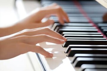 Obraz premium Close-up of Hands Playing Piano Keys: A Musical Moment.