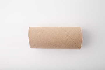 Empty cardboard tube on a white background. Recyclable paper roll for DIY crafts and eco-friendly projects