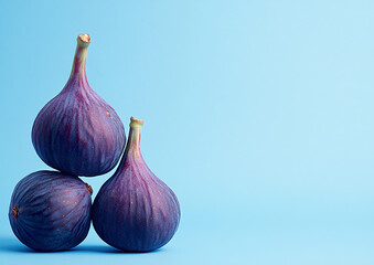 Fototapeta premium Fresh figs with soft purple skin arranged artistically on a wooden table, high-quality food photography, natural light, top-down view composition.