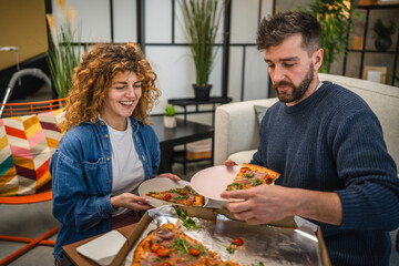 husband and wife eat pizza at home having time together with food