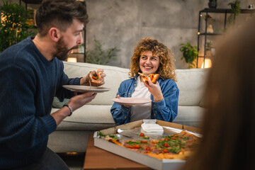 husband and wife eat pizza at home having time together with food