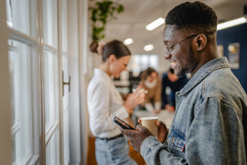 female and male colleague enjoy on the coffee break at office
