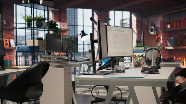 Empty AI tech agency workspace providing custom software development services. Machine learning technology running on PC in startup office to streamline coding process, jib up shot