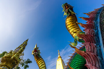 Background of beautiful religious tourist attractions, Naga statues, large churches at Wat Phra...
