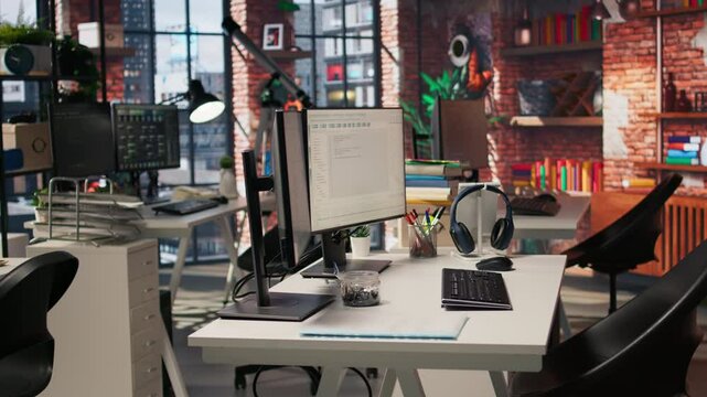 Empty AI tech agency office providing custom software development services. Technology venture workspace using machine learning to streamline coding process in startup office, jib down shot