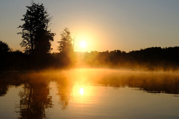 Fototapeta premium Morning summer dawn on foggy river