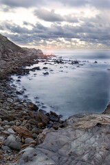 the Cala Viola gulf in the Porto Conte Regional Park, Alghero, Sassari, Sardinia, Italy. Long exposure and Motion blur on sea waves.