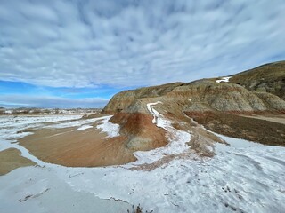 snow on high desert in Wyoming red sand