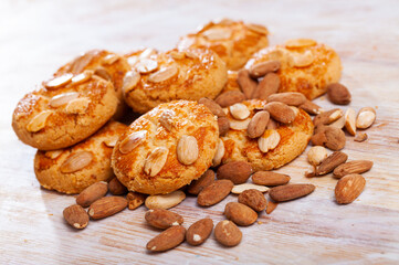 Homemade cookies with almond on wooden table