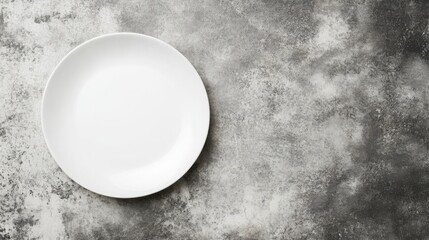 Empty Plate on Textured Background: A pristine white plate rests on a rustic textured background, inviting the viewer to imagine a culinary masterpiece to be unveiled.