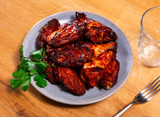 Plate of tasty snack - roasted chicken wings