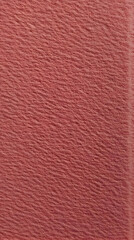 Fototapeta premium Close-up View of a Textured Dusty Rose Fabric Creates a Soft and Elegant Background.