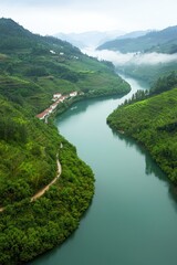 Serene River and Lush Green Mountainscape View