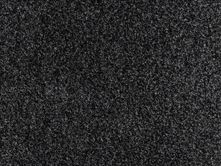 Fototapeta premium Black Textured Background with White Specks Shows Intricate Detail Close Up