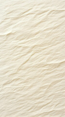 Close-up of crumpled beige fabric displays its texture and wrinkles gracefully.