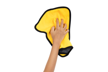 Human hand holding yellow rag and wiping table or cleaning something isolated on white background with clipping path.