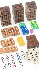 Obraz premium Colorful Wooden Blocks and Dice Arranged on White Background for Play and Learning
