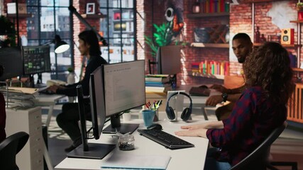 Startup programmer collaborating with colleague to test company software, identifying bottlenecks. Team of engineers writing clean, efficient code in programming language to reduce errors, camera A