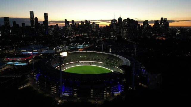 Melbourne, Australia &ndash; November 16, 2024: A stunning aerial shot of the Melbourne Cricket Ground (MCG) just after sunset, with the city skyline in the background. The iconic stadium stands as a symbol