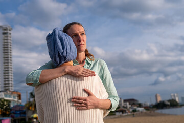 Moment friend support, resilience, and compassion, often associated with of battling cancer wearing...