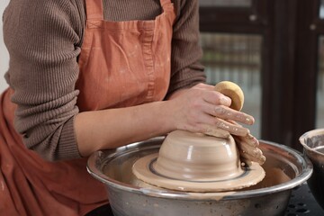 Hobby and craft. Woman making pottery indoors, closeup