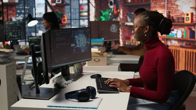 Programmer coding artificial intelligence algorithm in startup, refining machine learning models to enhance automation and data driven decision making. Woman using coding platform in office, camera A