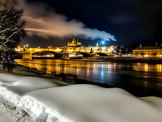 Naklejka premium Illuminated Bridge and Buildings Reflect in River with Snow and Moonlight