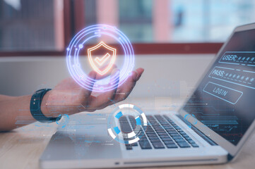 Cybersecurity and privacy data protection. Lock icon and internet network security technology. Businessman holding virtual icon showing protecting personal data on laptop and virtual interface